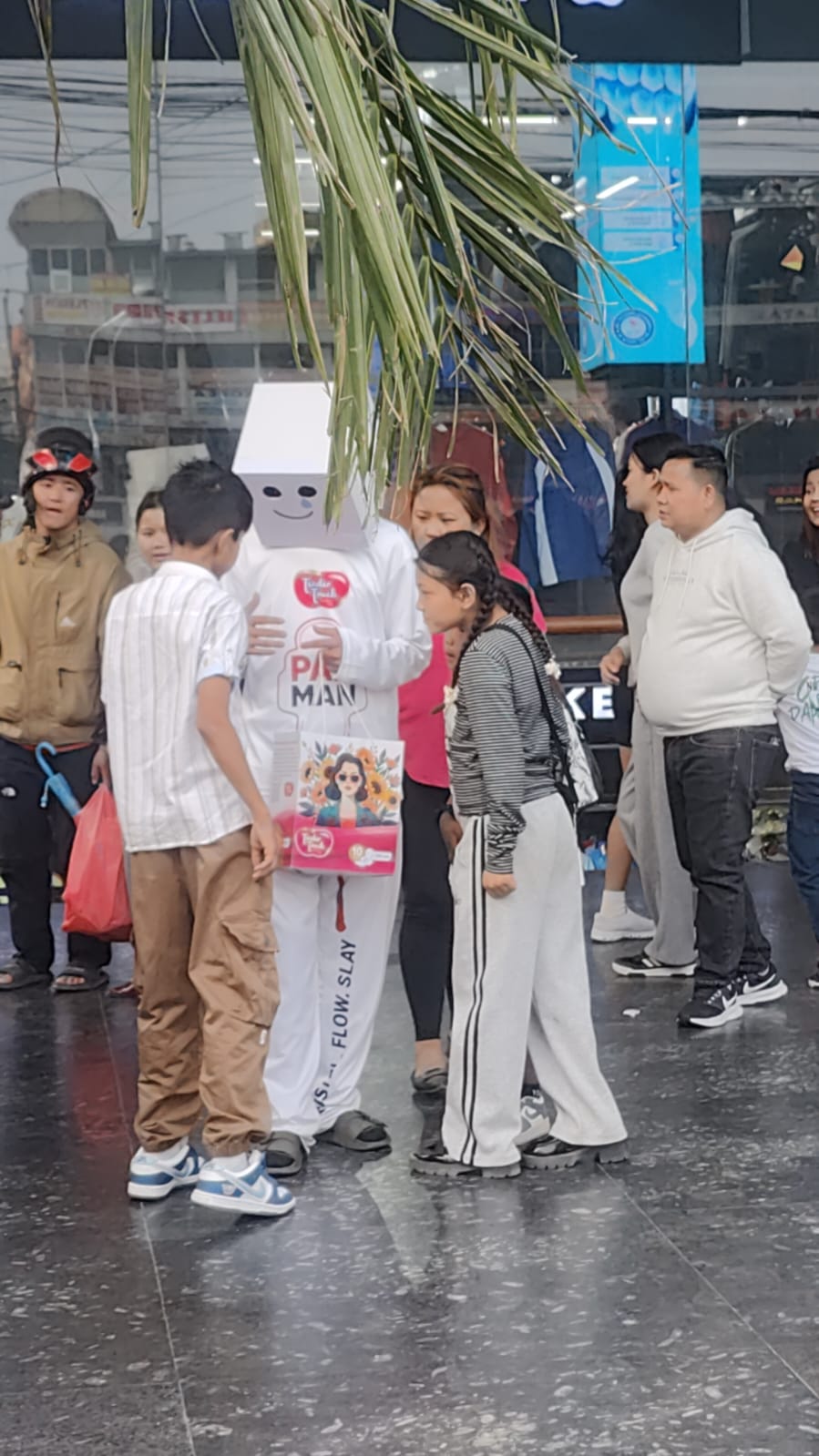 A PadMan ambassador engaging young visitors in a public space