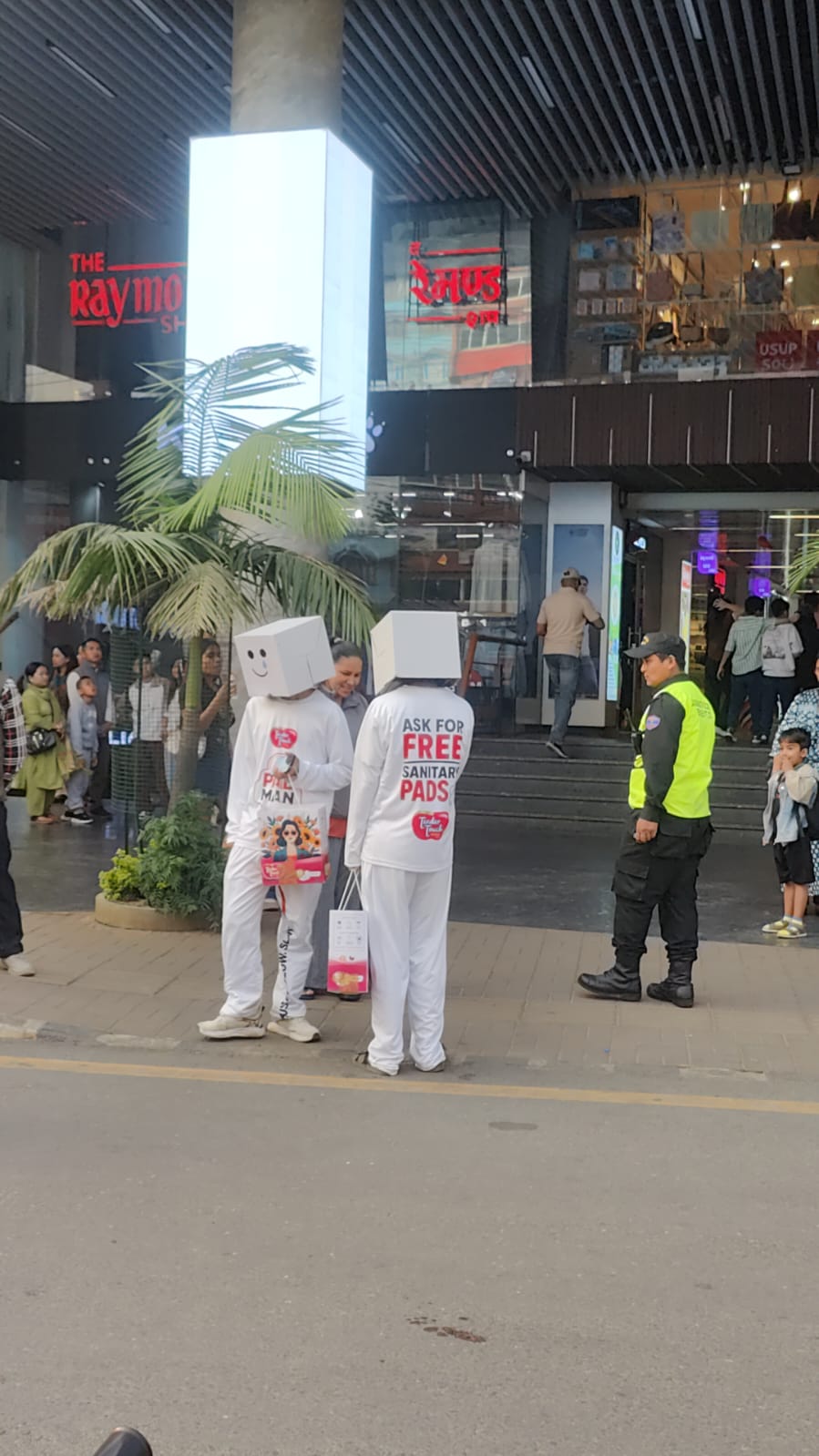 PadMan campaign ambassadors carrying sample bags outside a shopping centre